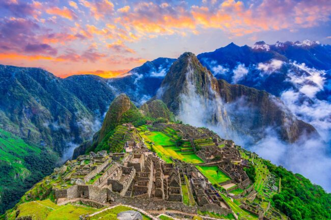 Machu Picchu, Cusco,Peru: Overview of the lost inca city Machu Picchu, agriculture terraces and Wayna Picchu, peak in the background,before sunrise