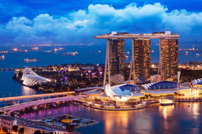 Singapore cityscape at dusk. Landscape of Singapore business building around Marina bay. Modern high building in business district area at twilight.